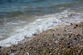 Sea white waves Stone beach