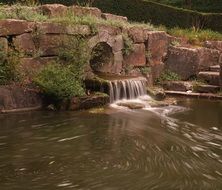 artificial waterfall in the pond