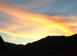 sun rays over the mountain at sunset