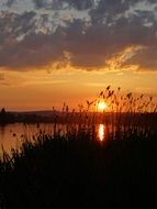 sunset over a lake in poland