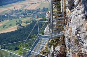 climbing staircase on mountain