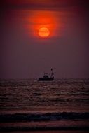 ship in the ocean during sunset