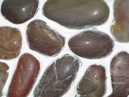 a mosaic of brown stones