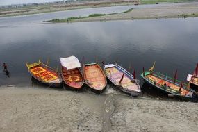 boats on a river bank