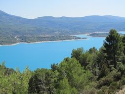 blue lake between green hills in France