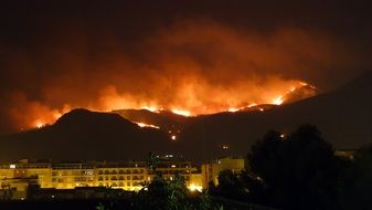 fire in mountains at night, spain, pego