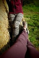 people sitting near the haystack