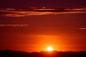 orange sun over mountains, usa, arizona