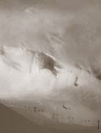 cable road on mountain slope beneath clouds, switzerland