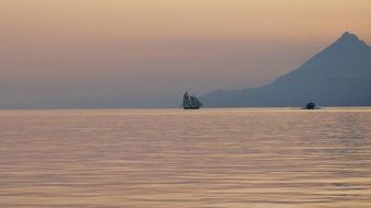 sailboat on the horizon of the sea