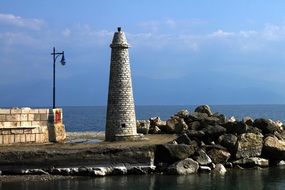 stone tower in a harbor