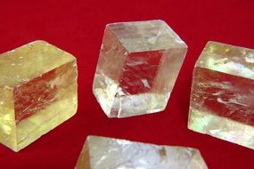 Colorful calcite stones on a red background