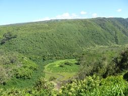panorama view of a green mountain valley on a sunny day