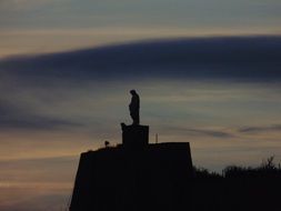 statue silhouette at twilight