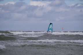 sailboat on the waves of the ocean