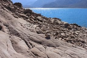 landscape of rocks and mountains on the blue sea coast