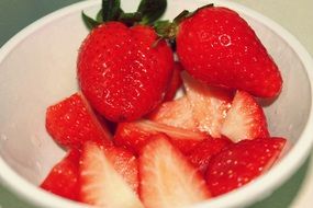 sliced strawberries in the plate