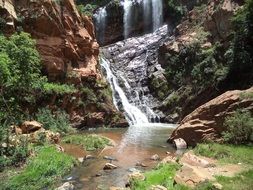 cascading waterfall in a botanical garden