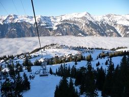 chairlift with a snow mountain view