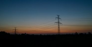 electric poles at dusk at sunset