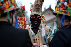 man in black mask at the carnival