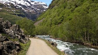 Beautiful landscape of green cycle path near the river in Norway