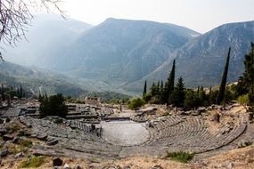 the ruins of an amphitheater in the mountains