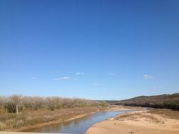 Oklahoma blue river in sandy area
