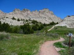 trail to the mountains in the badland national park, south dakota