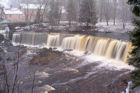 panorama of a wide waterfall on the river