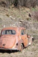 abandoned car near the mountain