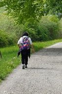 tourist with a backpack goes on a hiking trail