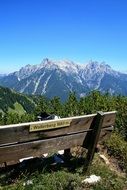 wooden bench in scenic mountain landscape