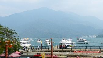 photo of tourist ships at the pier in Sun Moon Lake, Taiwan