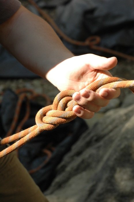 rope knot in climber's hands