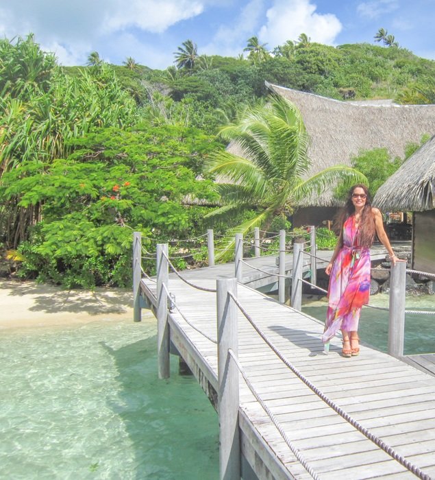 the girl in pink on the pier of Bora Bora