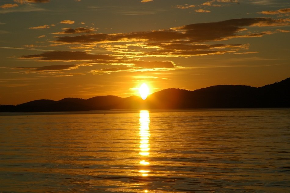 Solar path on lake at sunset