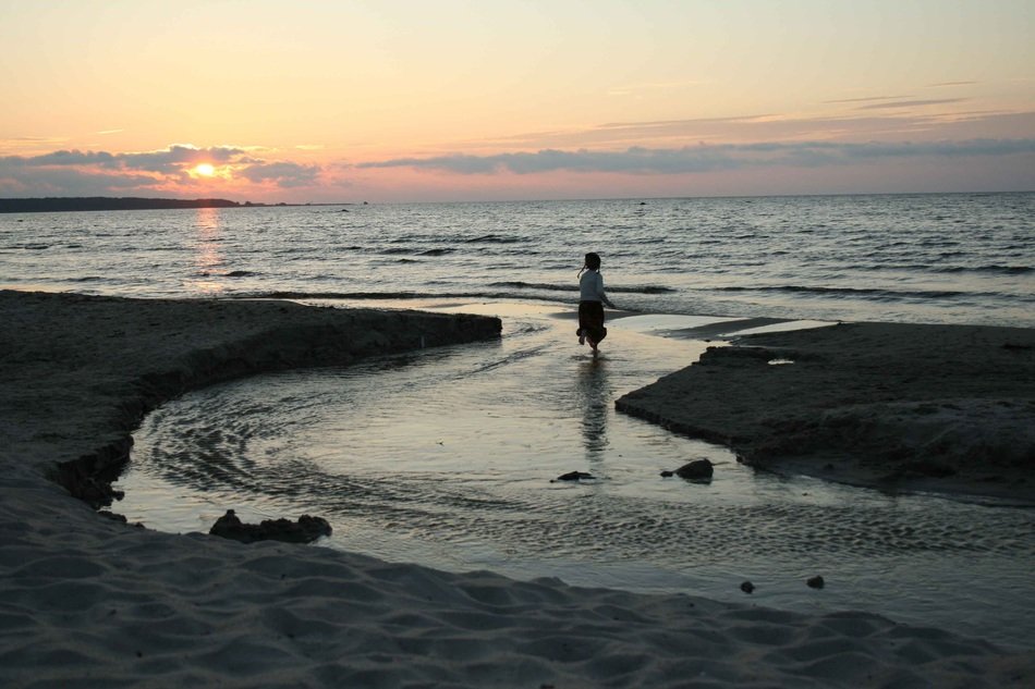 girl on the river in the evening