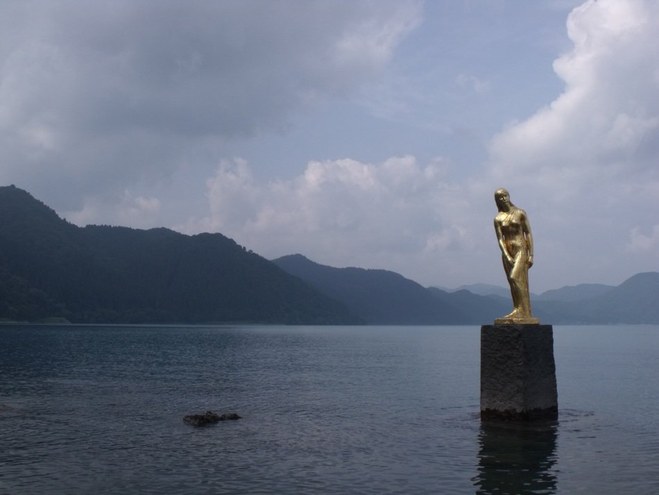 golden statue on tazawa lake