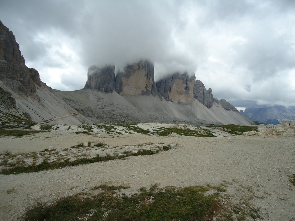 dolomites, scenic mountains beneath fluffy clouds