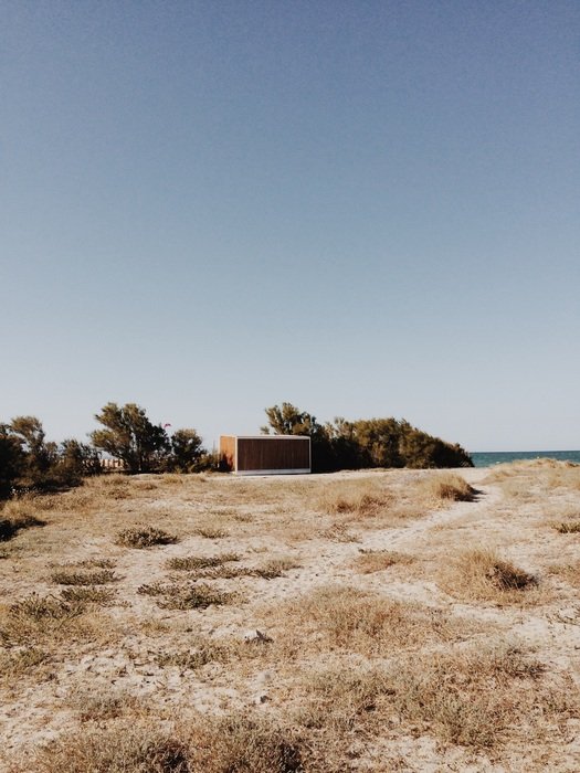 wild desert on the coast on the background of blue sky