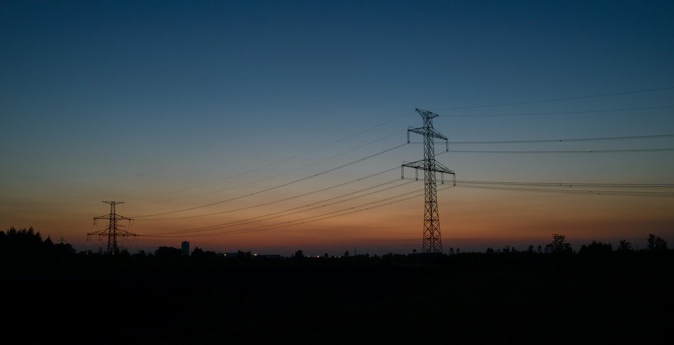electric poles at dusk at sunset