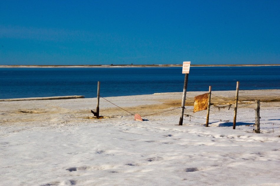travel ban on a sandy beach