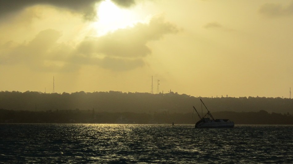boat on the water at sunset view of a venetian beach