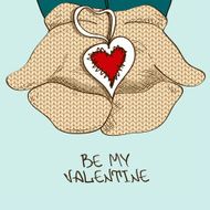 Illustration with hands in mittens holding heart