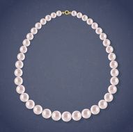 Round Pearls Necklace on dark background