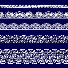 set of white lace ribbons on a blue background