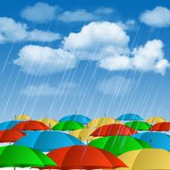 Colorful umbrellas in rain