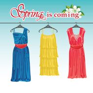 Three spring coctail dresses on a hanger Spring fashion