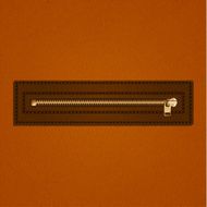 Metallic zipper on leather background